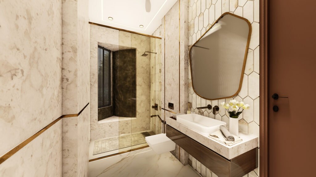 A beautifully crafted super-luxury bathroom designed by Vastukaar Studio, featuring rich marble textures, warm ambient lighting, and premium fixtures.